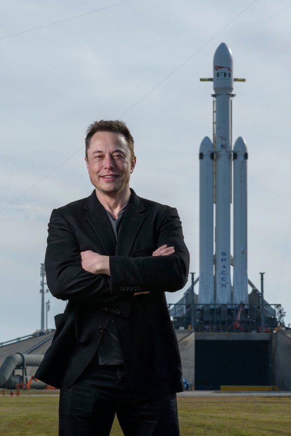 Elon Musk standing by Rocket